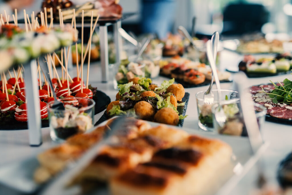 Table Full Of Tasty Food Beautifully Decorated.